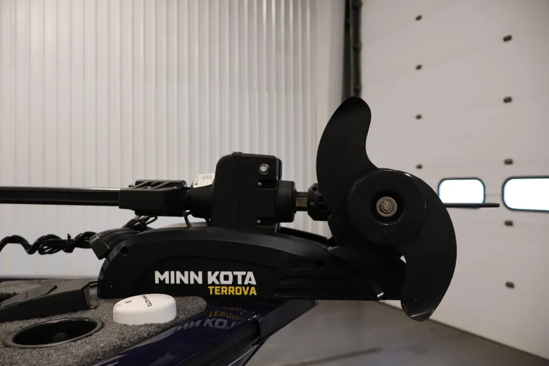 Slide: The Image of Minn Kota Terrova motor on 2024 Tracker Pro Guide V-16 WT boat in garage. - 13