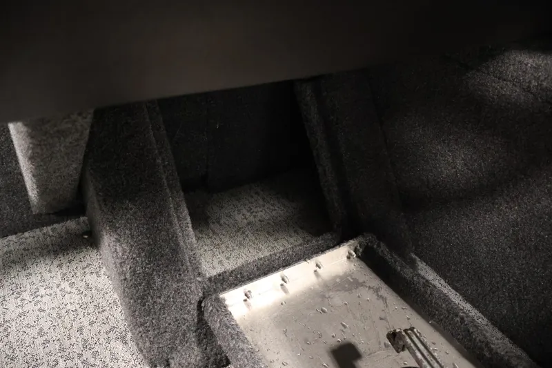 Slide: The Image of 2024 Tracker Pro Guide V-16 WT interior storage compartment, carpeted finish. - 27