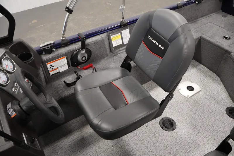 Slide: The Image of 2024 Tracker Pro Guide V-16 WT boat interior with steering wheel and seat. - 28
