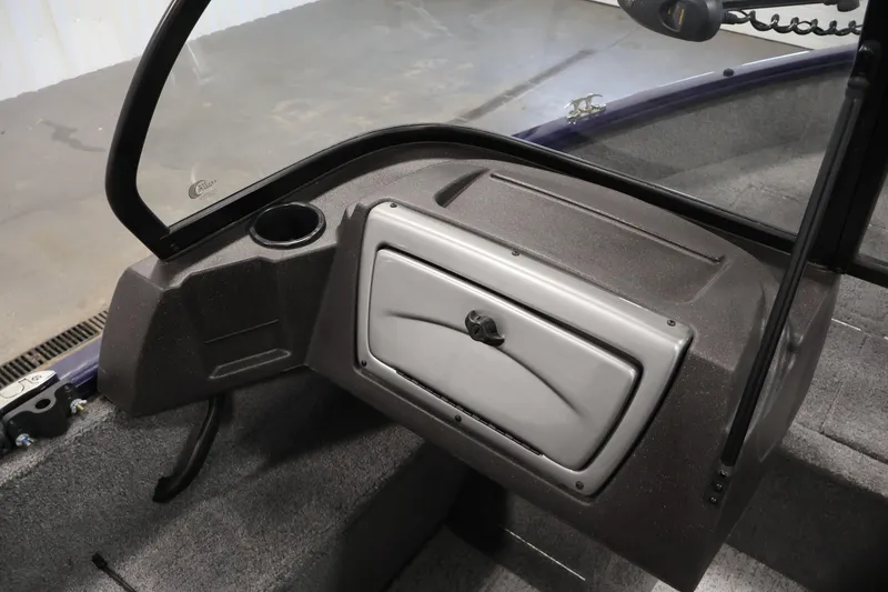 Slide: The Image of 2024 Tracker Pro Guide V-16 WT boat dashboard with windshield and storage compartment. - 29