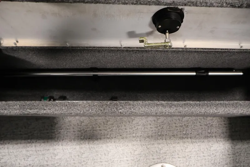 Slide: The Image of 2024 Tracker Pro Guide V-16 WT interior storage compartment with rod holder. - 34