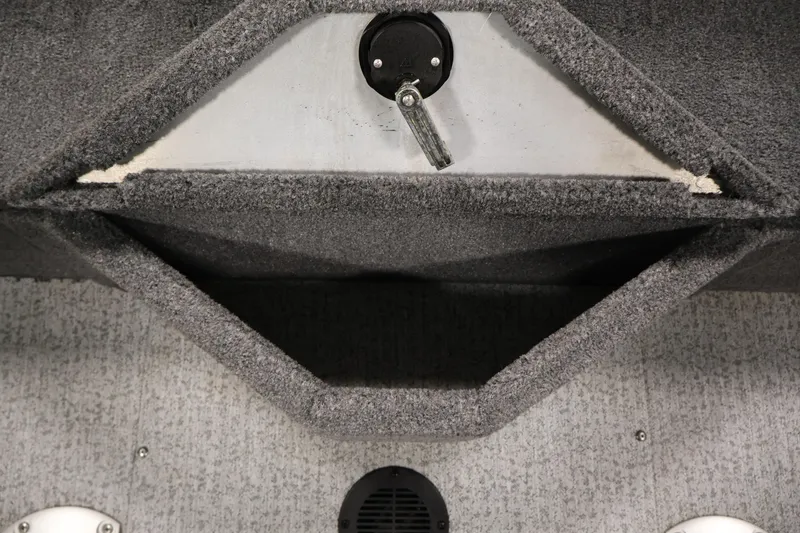Slide: The Image of 2024 Tracker Pro Guide V-16 WT boat interior storage compartment with carpeted finish. - 35