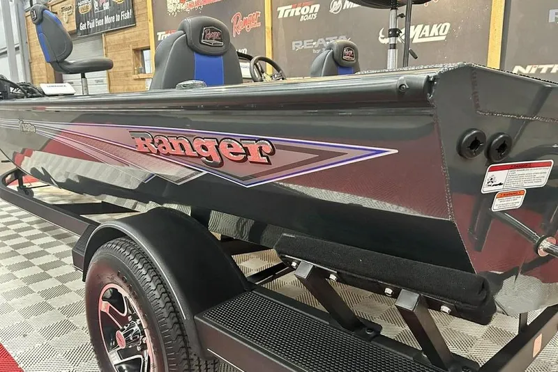 Slide: The Image of 2024 Ranger RT188P boat on display, featuring sleek design and branding. - 13