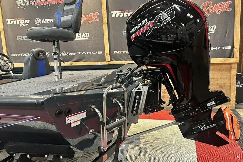 Slide: The Image of 2024 Ranger RT188P boat with Mercury Pro XS engine, displayed at a boat show. - 4