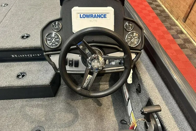 Slide: The Image of 2024 Ranger RT188P boat dashboard with steering wheel and Lowrance Elite display. - 7