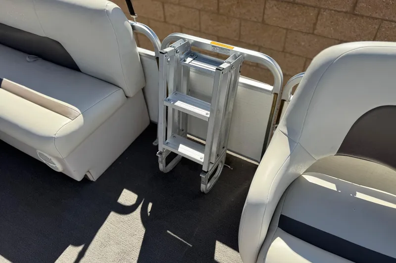 Slide: The Image of Interior of 1999 Godfrey Parti Kraft 240 ES with seating and foldable ladder. - 15