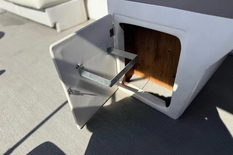 Slide: The Image of Open storage compartment on 1999 Godfrey Parti Kraft 240 ES boat. - 22