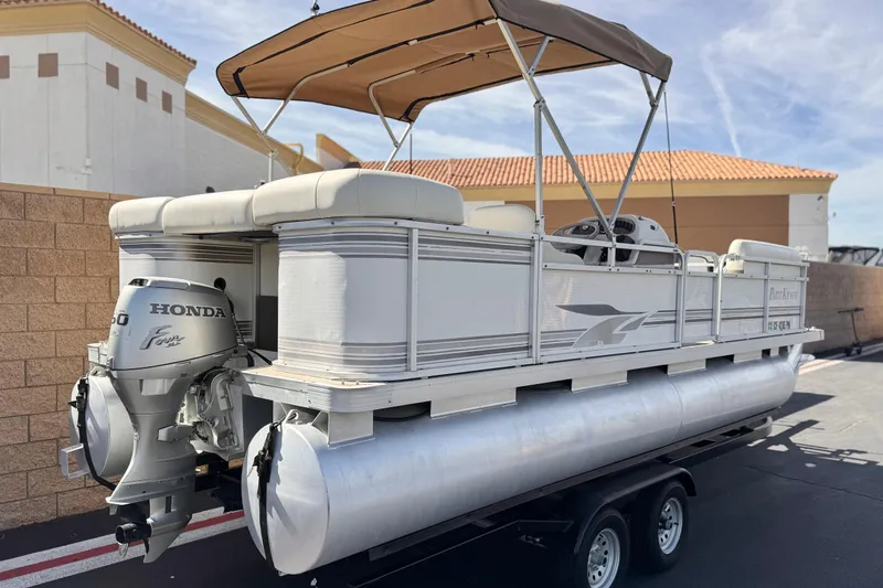 Slide: The Image of 1999 Godfrey Parti Kraft 240 ES pontoon boat with Honda outboard motor on trailer. - 6