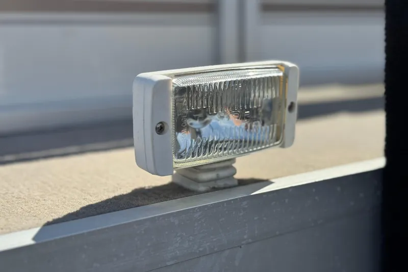 Slide: The Image of Close-up of a 1999 Godfrey Parti Kraft 240 ES boat light fixture. - 9