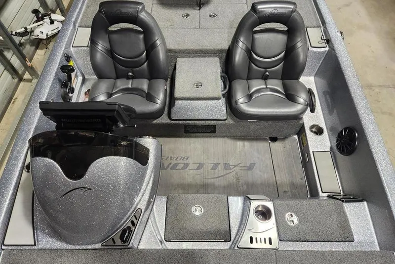 Slide: The Image of 2019 Falcon F195 boat interior with dual black seats and control panel. - 12