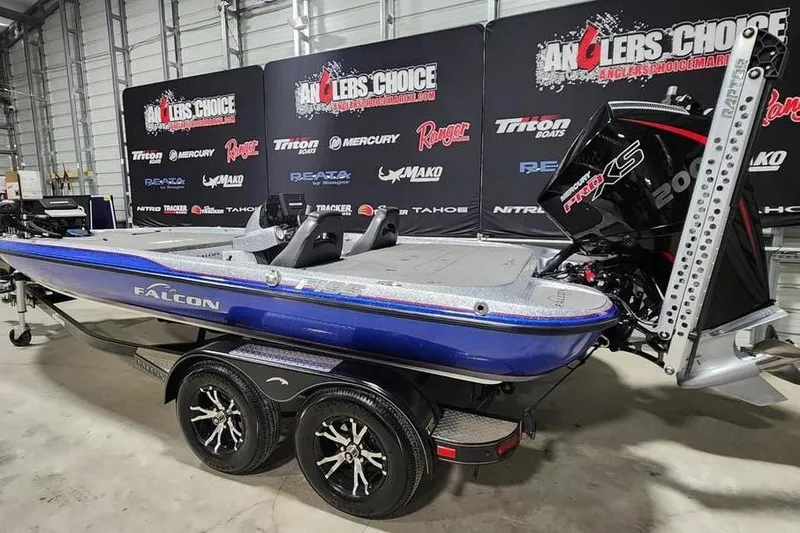 Slide: The Image of 2019 Falcon F195 boat with powerful engine on display in showroom. - 2