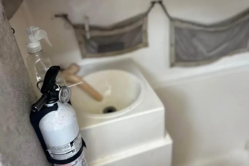 Slide: The Image of Fire extinguisher and sink in 1997 Sea Cat SL5C boat interior. - 11