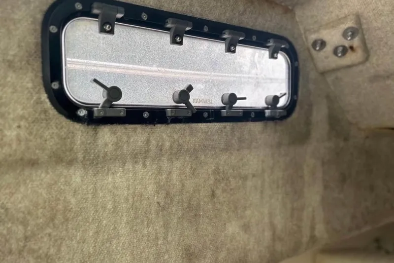 Slide: The Image of 1997 Sea Cat SL5C interior with a rectangular window and beige upholstery. - 12