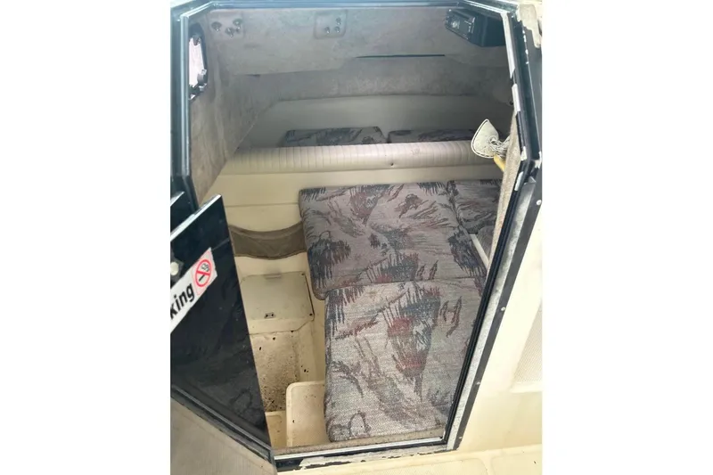 Slide: The Image of 1997 Sea Cat SL5C cabin interior with patterned cushions and no smoking sign. - 9
