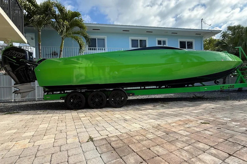 Slide: The Image of Green E-Ticket 29 boat on trailer, year 2021. - 2