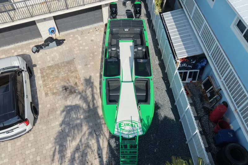Slide: The Image of Overhead view of a 2021 E-Ticket 29 boat in a driveway. - 6