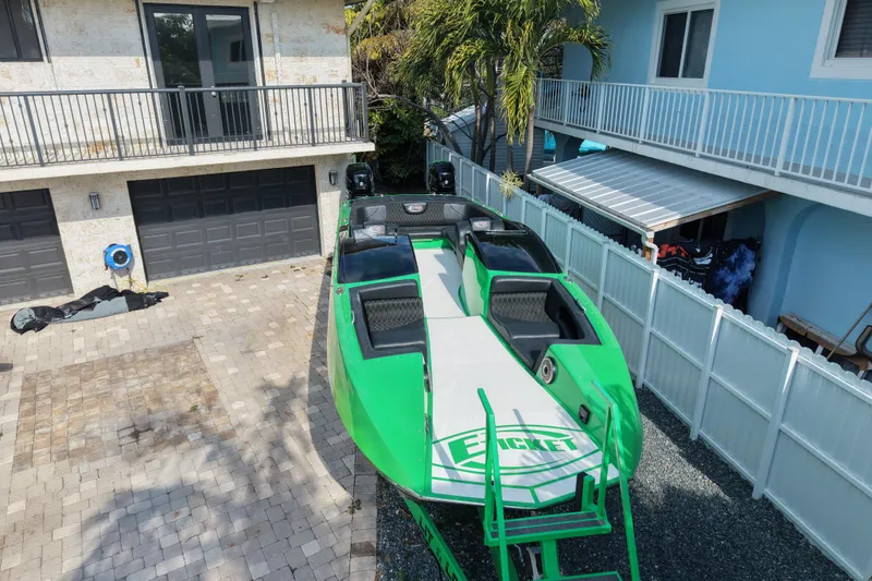 Slide: The Image of Green 2021 E-Ticket 29 boat parked in a residential driveway. - 8