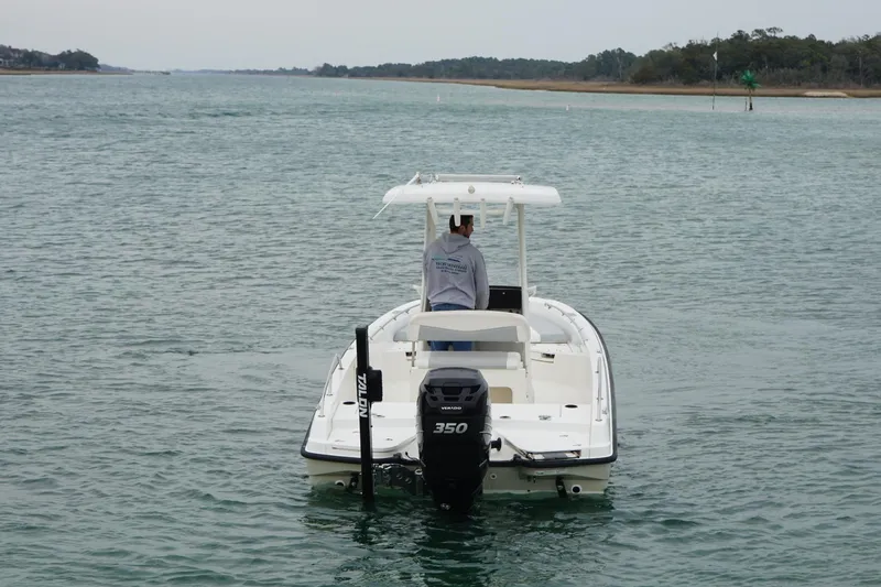 Slide: The Image of 2016 Boston Whaler 240 Dauntless boat cruising on calm waters. - 14