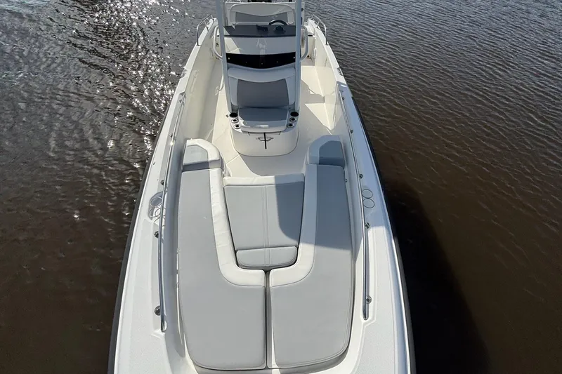 Slide: The Image of 2016 Boston Whaler 240 Dauntless boat on water, featuring sleek design and comfortable seating. - 24