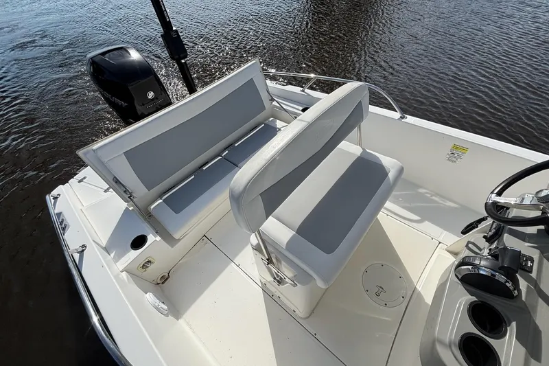Slide: The Image of 2016 Boston Whaler 240 Dauntless boat interior with seating and steering wheel. - 31