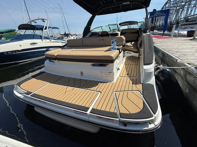 Slide: The Image of The image shows a 2026 Sea Ray SLX 280 boat docked at a pier. - 17