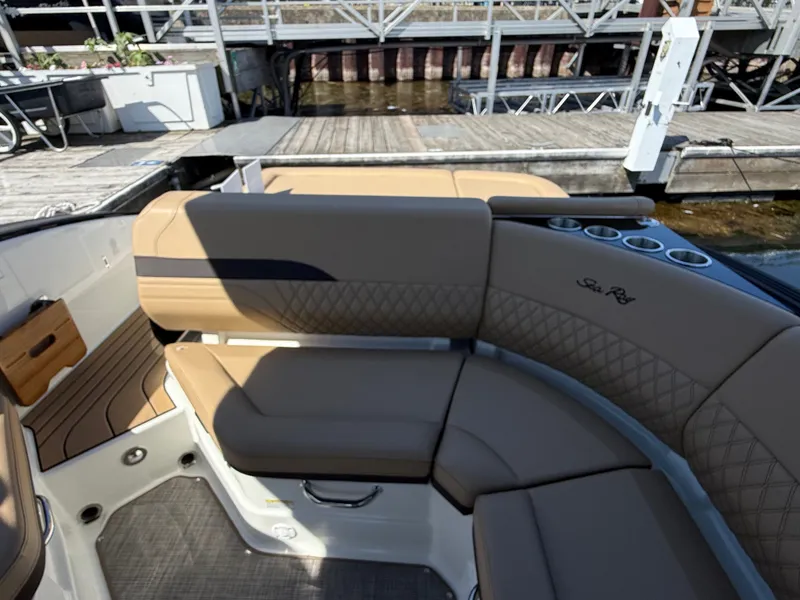 Slide: The Image of Interior view of a Sea Ray SLX 280 with sleek, cushioned seating and cup holders. - 26
