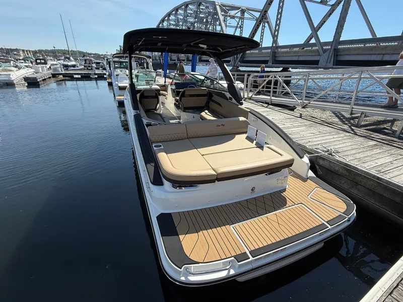 Slide: The Image of 2026 Sea Ray SLX 280 docked with a bridge in the background. - 15