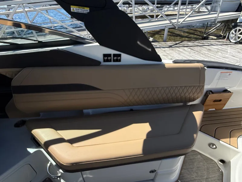 Slide: The Image of Interior view of a Sea Ray SLX 280 with beige upholstery and modern design. - 27