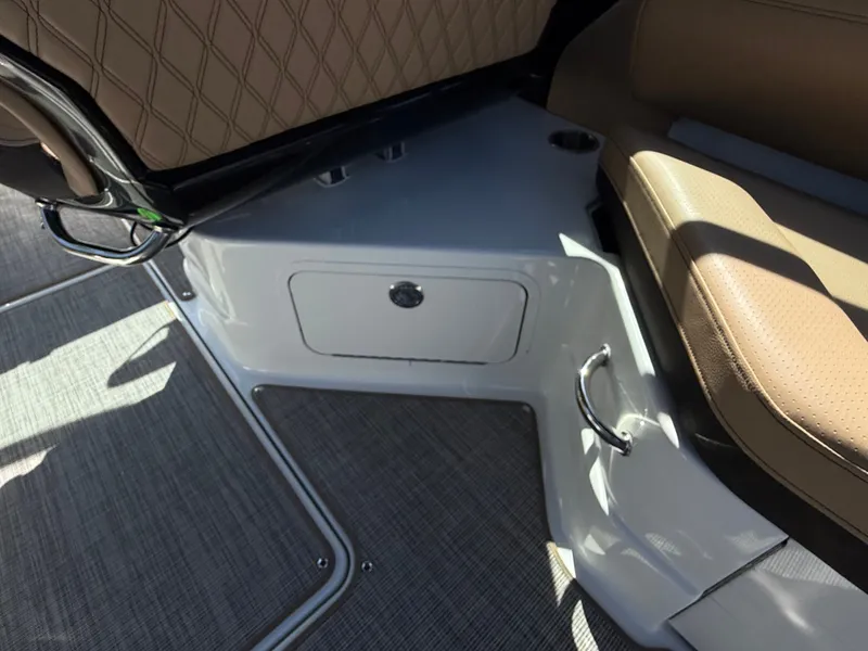 Slide: The Image of Interior of a Sea Ray SLX 280 boat with brown seating and storage compartment. - 30