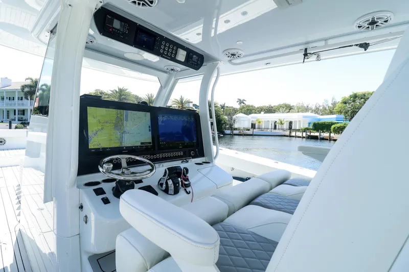 Slide: The Image of Luxury Freeman 47 boat deck with wooden table and Mercury engines, 2022 model. - 17