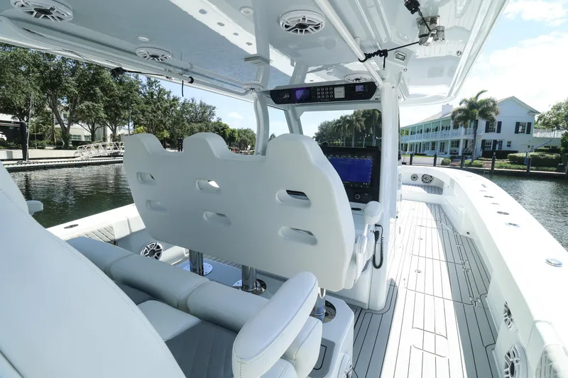 Slide: The Image of Wooden fishing rod holder on a 2022 Freeman 47 boat, featuring metal cup inserts. - 18