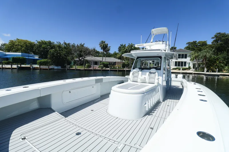 Slide: The Image of Luxury seating on a 2022 Freeman 47 boat, featuring sleek design and waterfront view. - 22