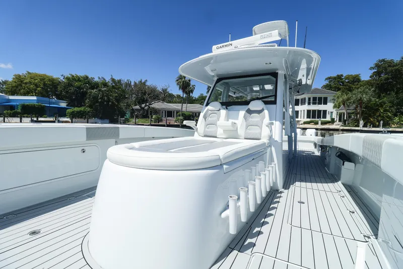 Slide: The Image of Luxury seating on a 2022 Freeman 47 boat, featuring plush white and gray upholstery. - 23