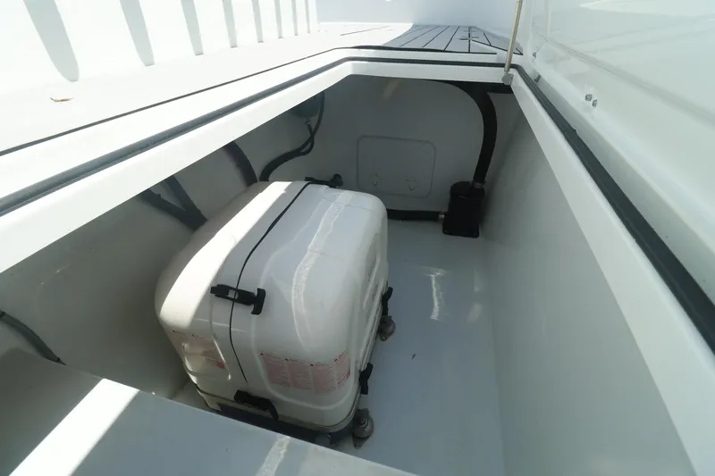 Slide: The Image of Freeman 47 boat, 2022 model, docked in a serene waterfront setting. - 27