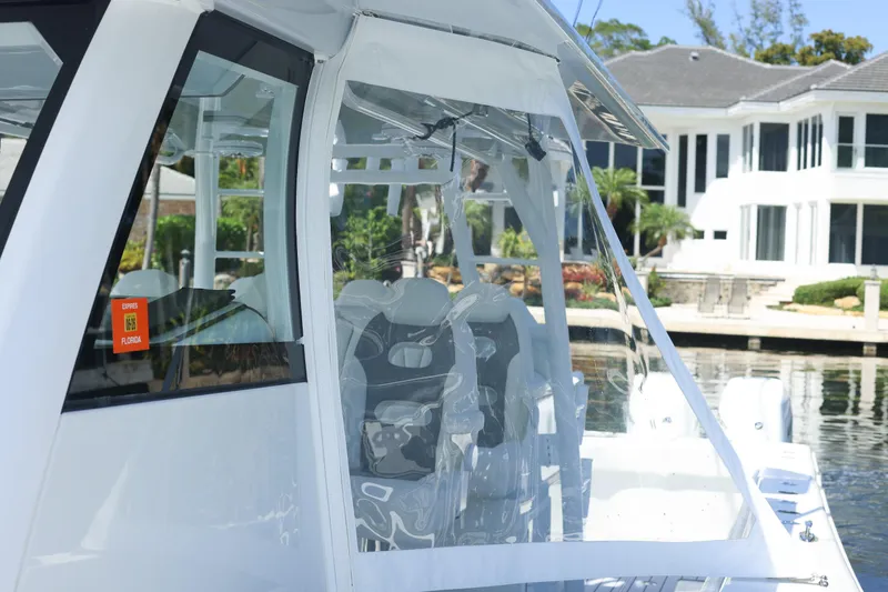 Slide: The Image of Luxurious seating on a 2022 Freeman 47 boat, featuring white and gray quilted upholstery. - 44