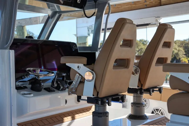 Slide: The Image of Interior of 2022 Freeman 47 boat with modern helm and leather seats. - 8