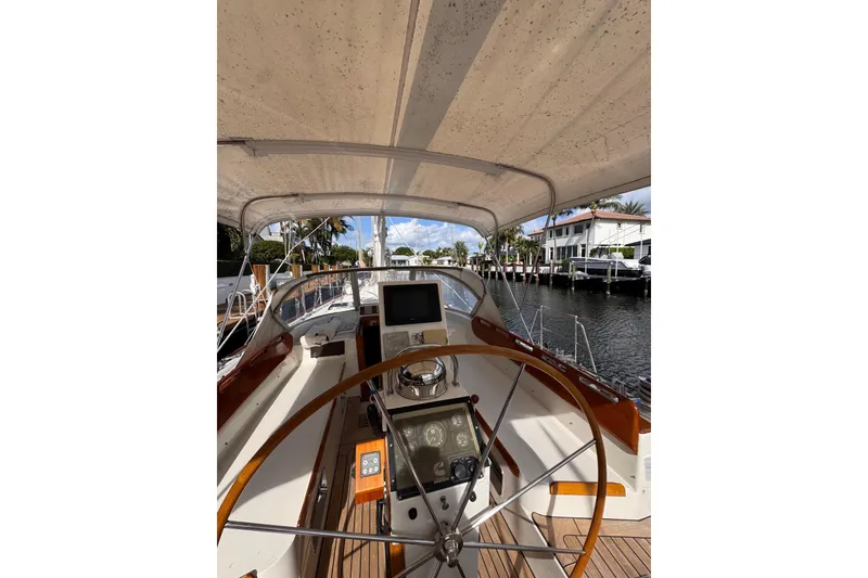 Slide: The Image of Cockpit view of 1989 Little Harbor Sloop 58' with steering wheel and navigation equipment. - 102