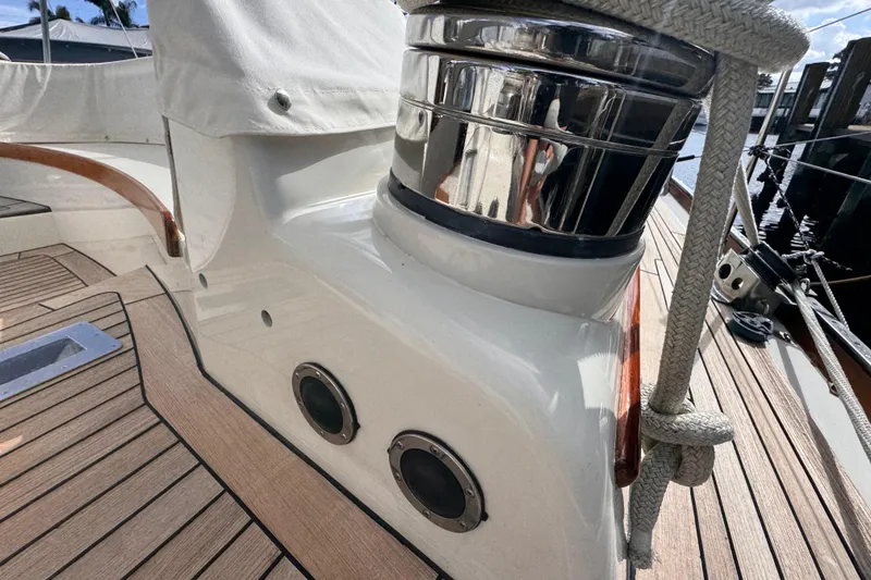 Slide: The Image of Close-up of 1989 Little Harbor Sloop 58' deck with polished winch and teak flooring. - 12