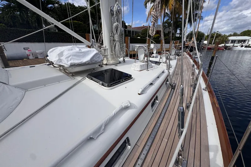 Slide: The Image of 1989 Little Harbor Sloop 58' sailboat deck with rigging and wooden accents. - 25