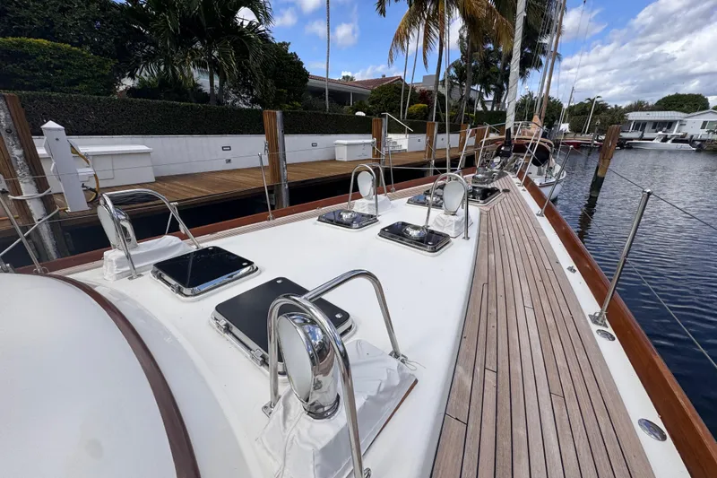 Slide: The Image of 1989 Little Harbor Sloop 58' yacht docked, showcasing sleek deck design and polished fittings. - 27
