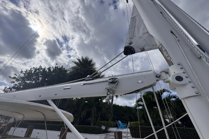 Slide: The Image of 1989 Little Harbor Sloop 58' sailboat mast and rigging under cloudy sky. - 30
