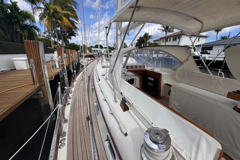 Slide: The Image of 1989 Little Harbor Sloop 58' docked, showcasing elegant deck and spacious cockpit area. - 34