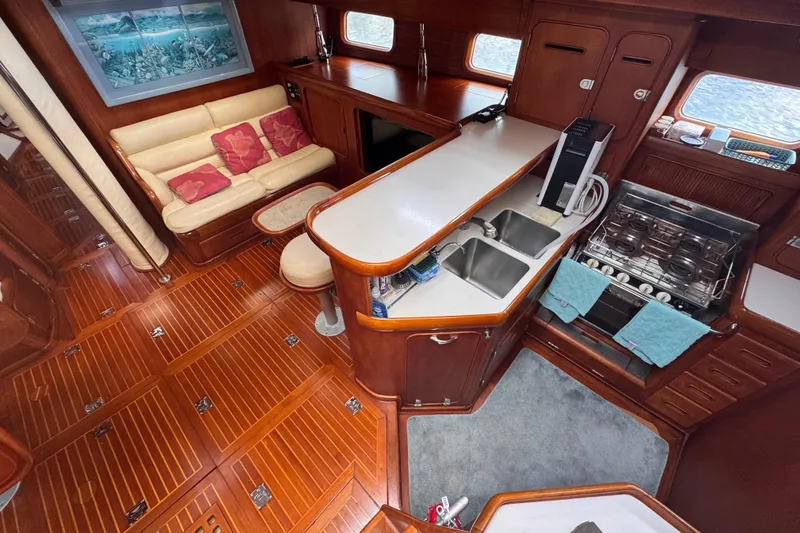 Slide: The Image of Luxurious 1989 Little Harbor Sloop interior with elegant wood finish and modern kitchen amenities. - 45