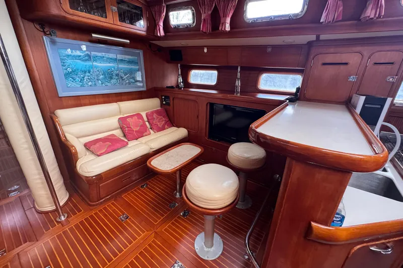 Slide: The Image of Luxurious 1989 Little Harbor Sloop interior with elegant wood finish and cozy seating area. - 48