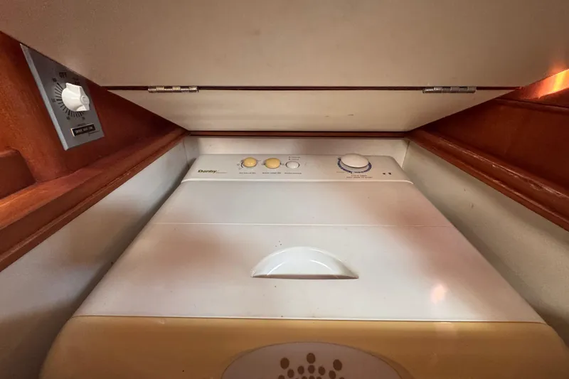 Slide: The Image of Laundry area inside 1989 Little Harbor Sloop 58' yacht, featuring a Danby appliance. - 69