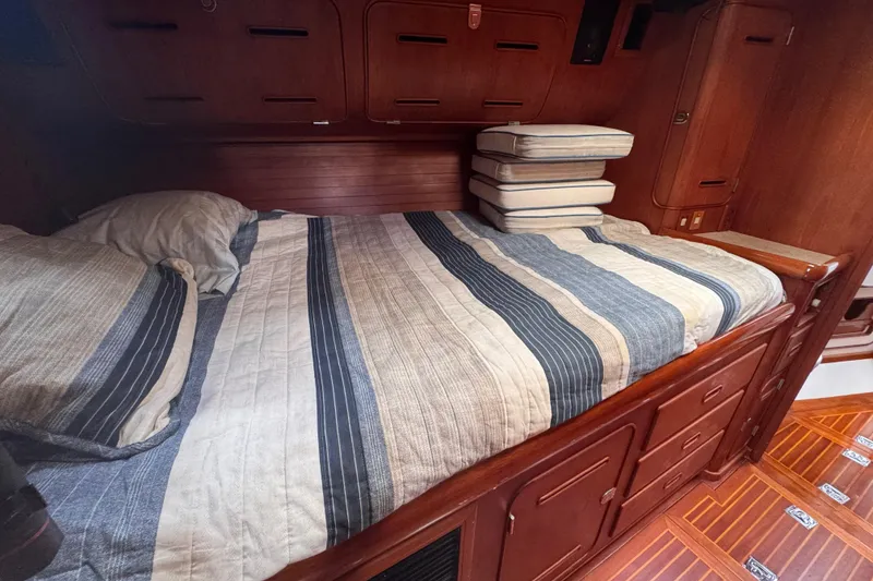 Slide: The Image of Cozy cabin interior of 1989 Little Harbor Sloop 58' with striped bedding. - 71