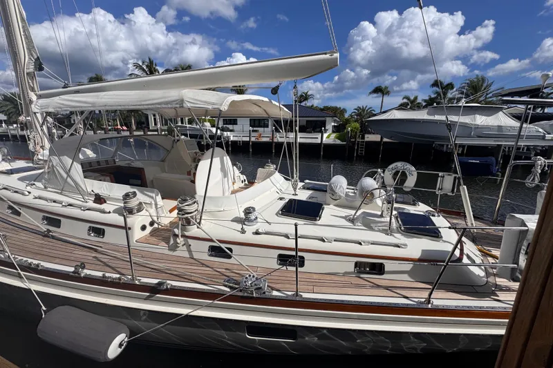 Slide: The Image of 1989 Little Harbor Sloop 58' docked, featuring elegant design and spacious deck. - 9