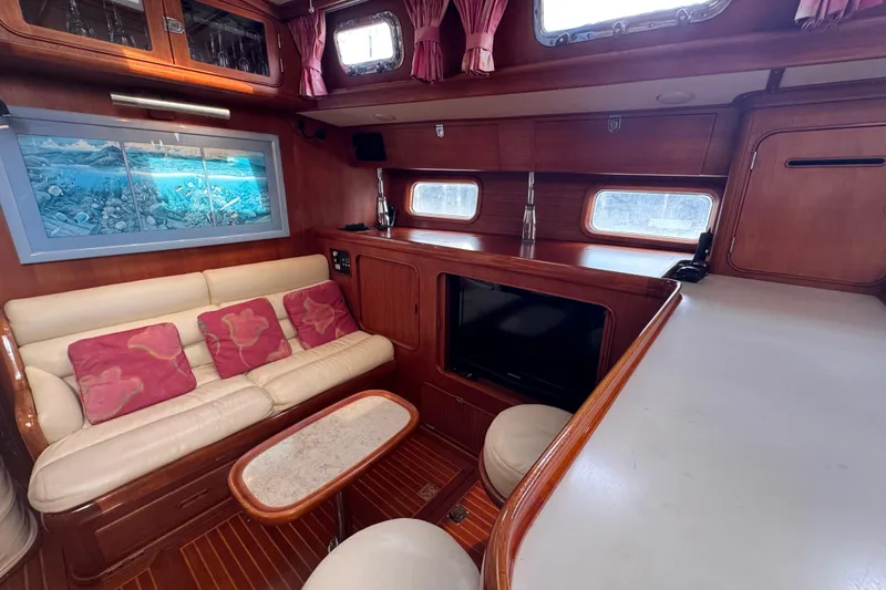 Slide: The Image of Luxurious 1989 Little Harbor Sloop 58' interior with cozy seating and elegant wood finishes. - 90