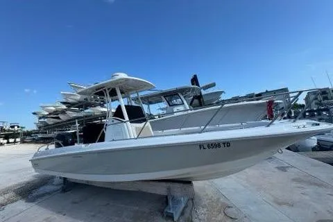 Slide: The Image of 2018 Boston Whaler Dauntless 240 boat on dry dock under clear blue sky. - 15