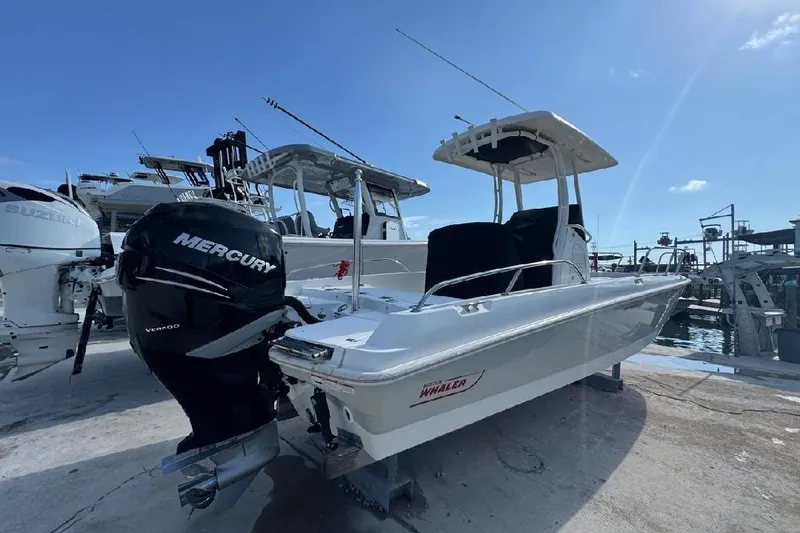 Slide: The Image of 2018 Boston Whaler Dauntless 240 boat with Mercury engine docked at marina. - 16